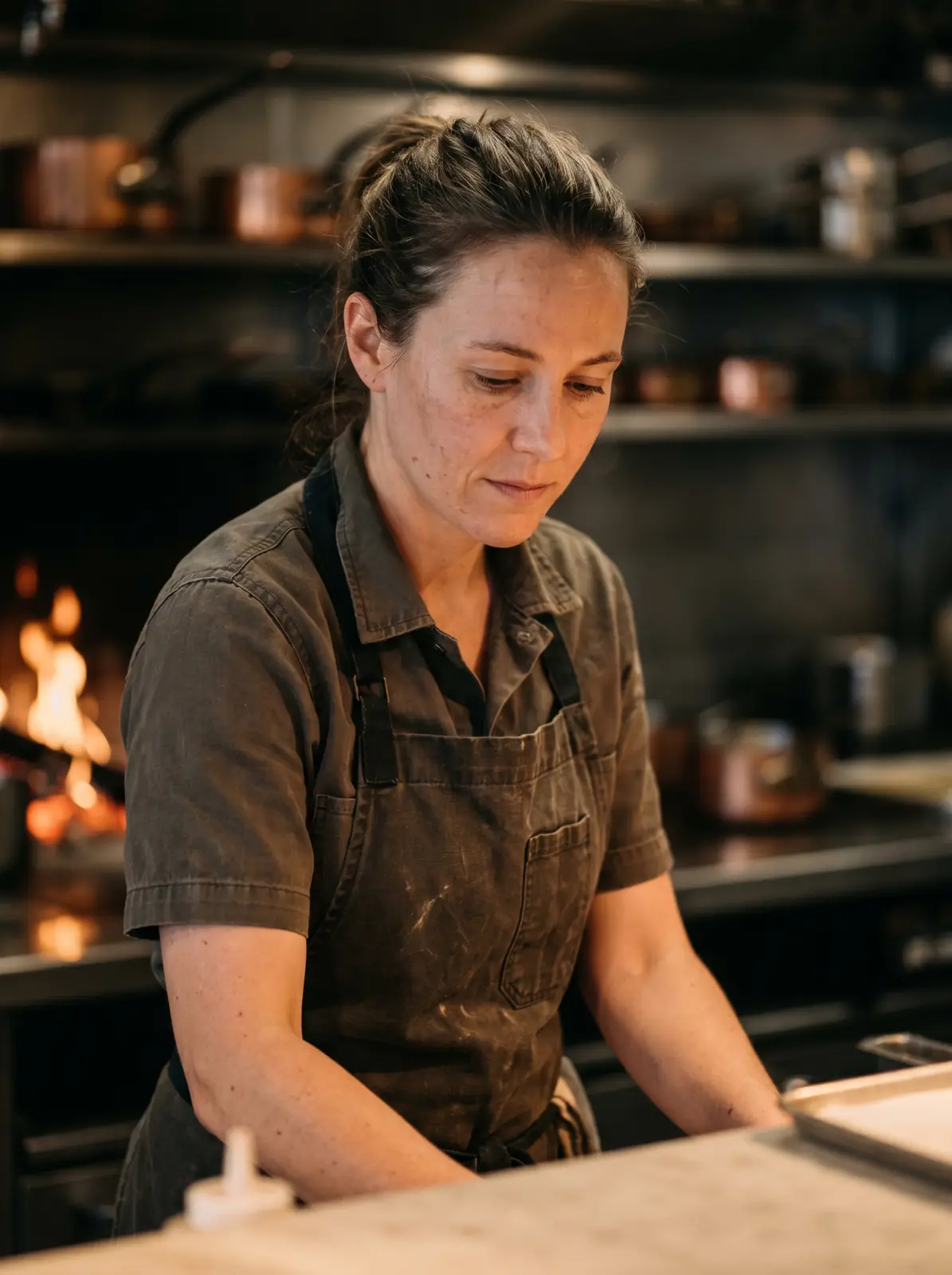 Núria Soler, sous chef, plating at the pass