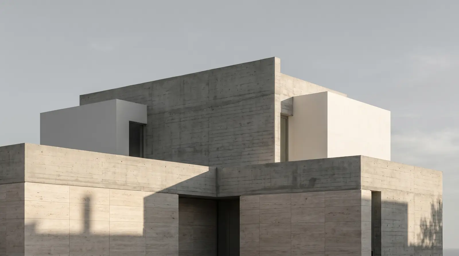 Casa Montjuic: A modernist concrete villa with clean geometric lines and minimalist white facades